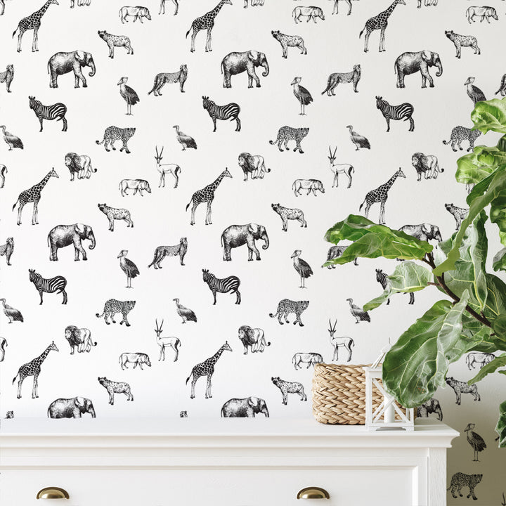 Minimalist black and white animal wallpaper with safari creatures including lions, giraffes, elephants, and antelopes, eco-friendly peel-and-stick or pre-pasted options for easy DIY installation.