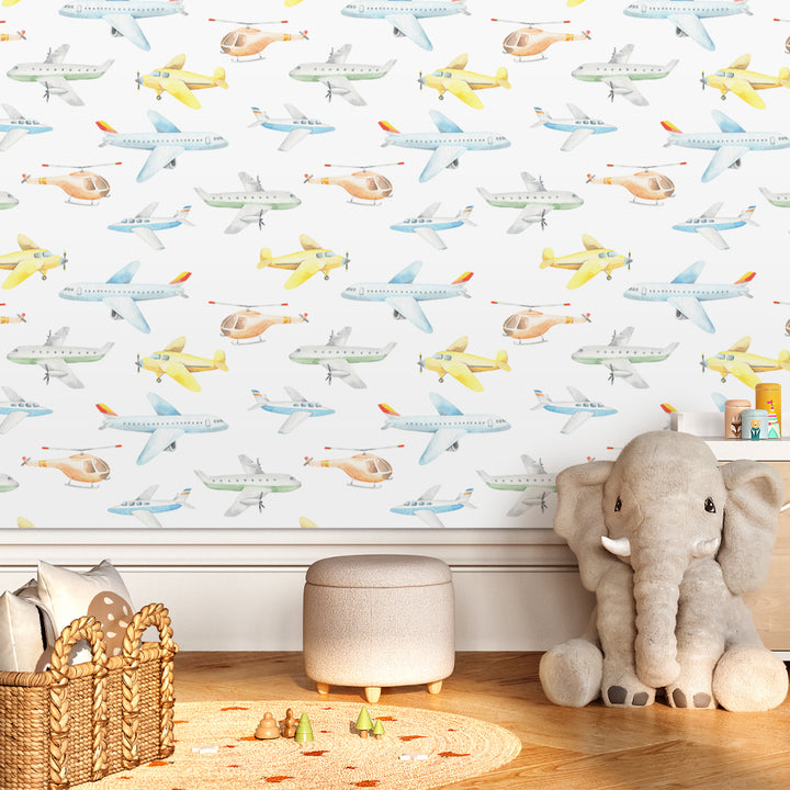 Watercolor airplane nursery wallpaper with pastel aircraft and helicopters in a repeating pattern, gender neutral aviation wall design removable without damage.