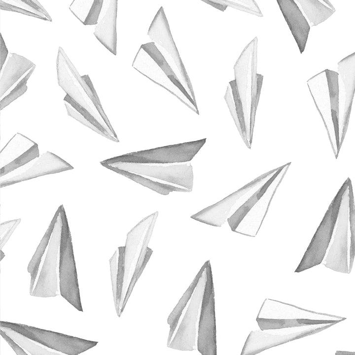 Scandinavian-inspired paper airplane wallpaper in black and gray tones on white, designed as removable peel and stick or pre-pasted material for easy installation.