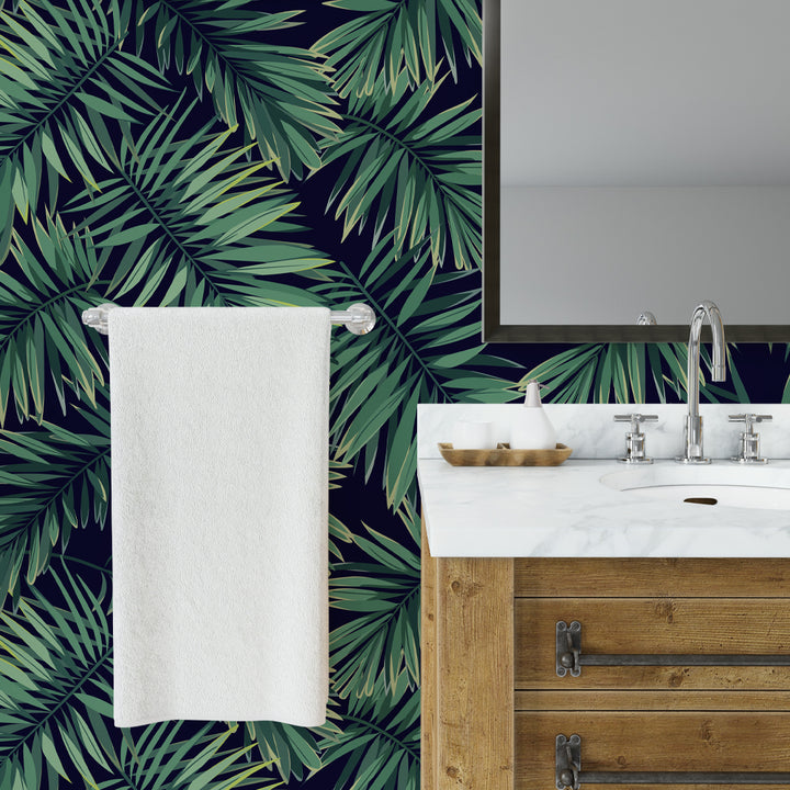 Tropical palm leaf wallpaper featuring lush green fronds on a deep navy background, removable peel and stick or pre-pasted design for living room or bedroom décor.