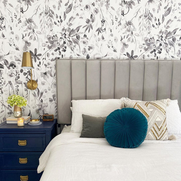 Grayscale floral wallpaper design with painted petals, falling leaves, and botanical detailing in a soft sketchy watercolor style for modern, minimalist, or nursery spaces.