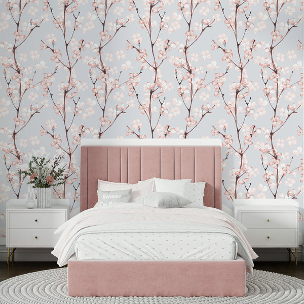 Cherry blossom floral wallpaper featuring soft pink blooms and branches on a pastel background, available as removable peel and stick or pre-pasted wallpaper for easy installation.