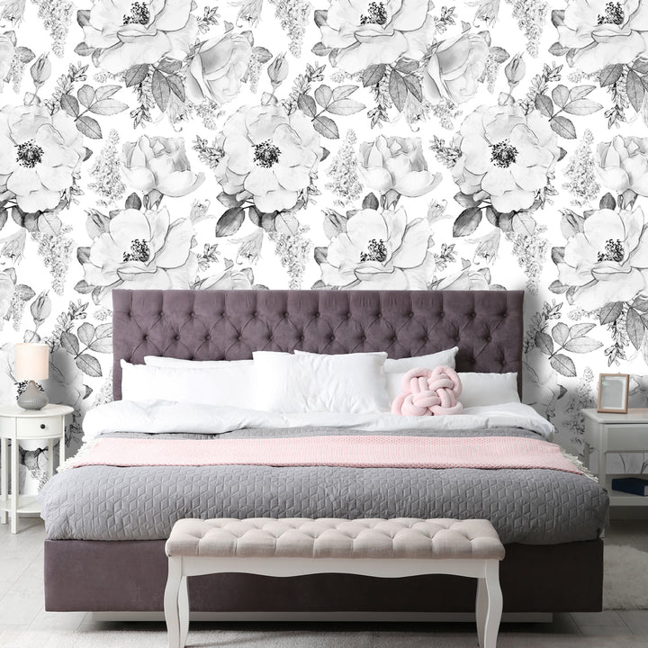 Hand-drawn grey and white floral wallpaper with oversized botanical blooms, offered in peel and stick or pre-pasted removable panels, ideal for statement walls or nursery ceilings.