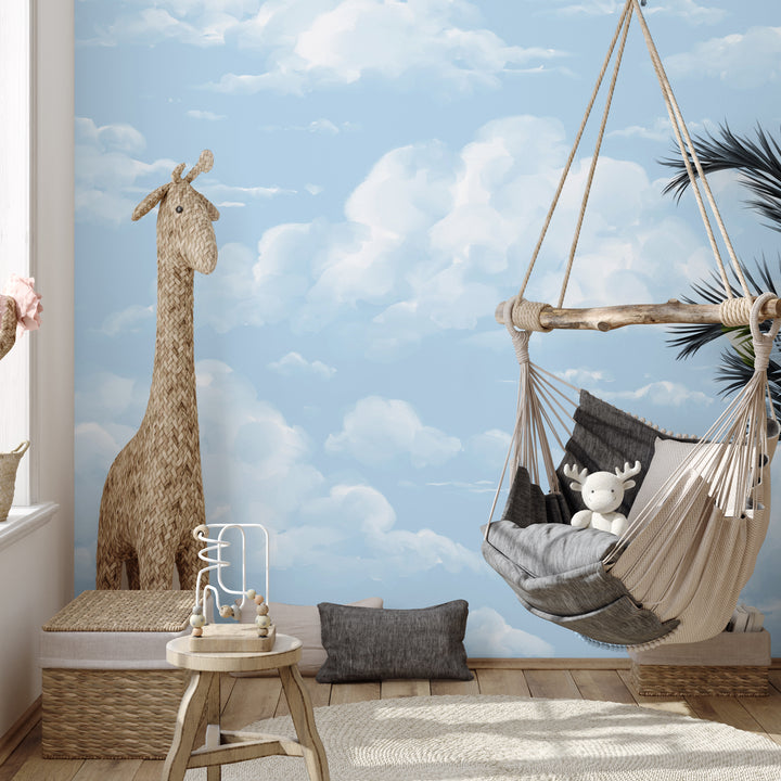 Blue cloud mural design with painterly, whimsical clouds across a bright sky, printed on damage-free peel and stick or pre-pasted wallpaper for effortless decorating.