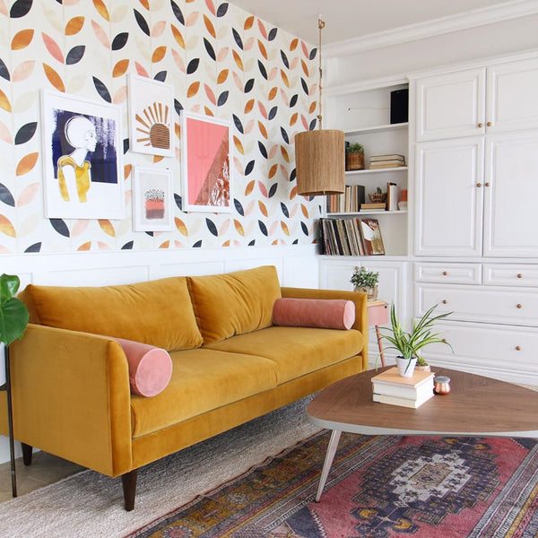 Retro leaf wallpaper featuring blush, navy, gold, and neutral-toned leaves in a repeating vertical pattern, available in peel and stick or pre-pasted removable wallpaper material.