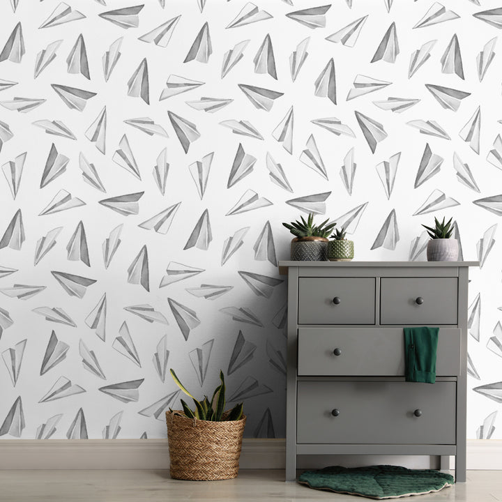 Minimalist paper plane wallpaper with scattered airplane drawings in a monochrome design, ideal for modern nurseries, kids rooms, or gender-neutral spaces.