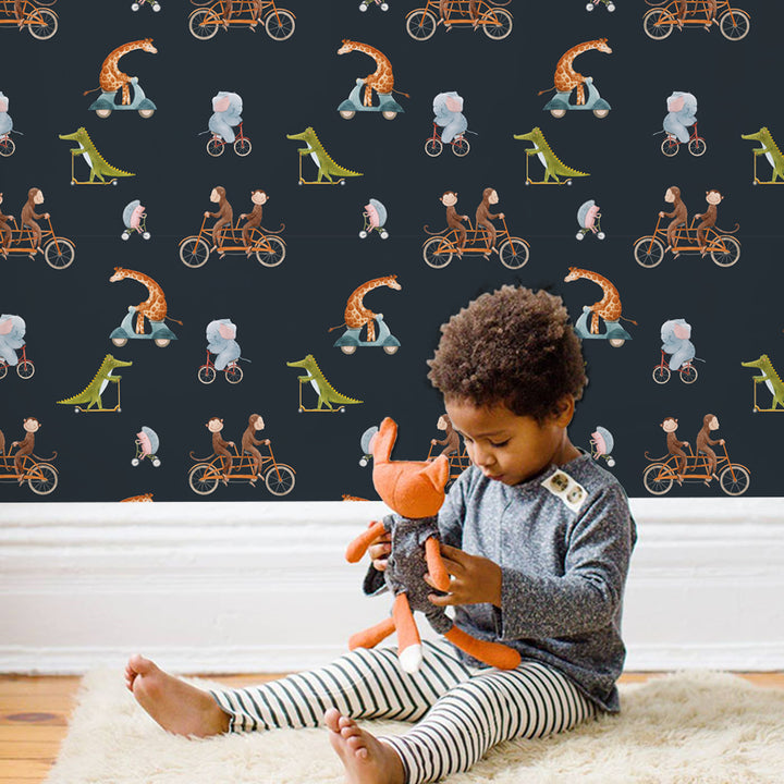 Animal parade wallpaper for kids’ rooms featuring safari animals riding bicycles on a navy background, available in peel and stick or pre-pasted options.