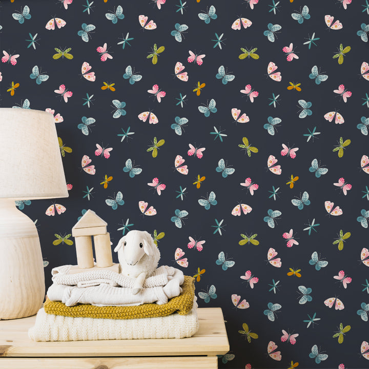 Butterfly and dragonfly wallpaper design with colorful watercolor details on a deep navy background, perfect for cozy nurseries or stylish kids’ rooms.