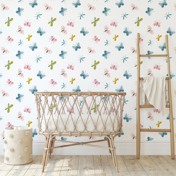 Watercolor butterfly nursery wallpaper in soft pastel colors featuring hand-painted butterflies and dragonflies, available in peel and stick or pre-pasted options.