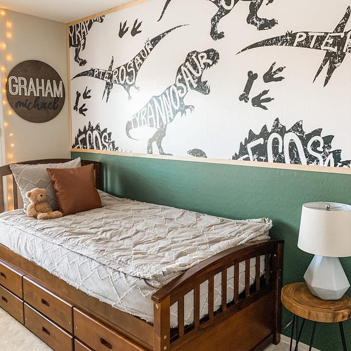 Large black dinosaur print wallpaper mural with educational typography dinosaur names, printed on removable wallpaper panels for DIY installation.