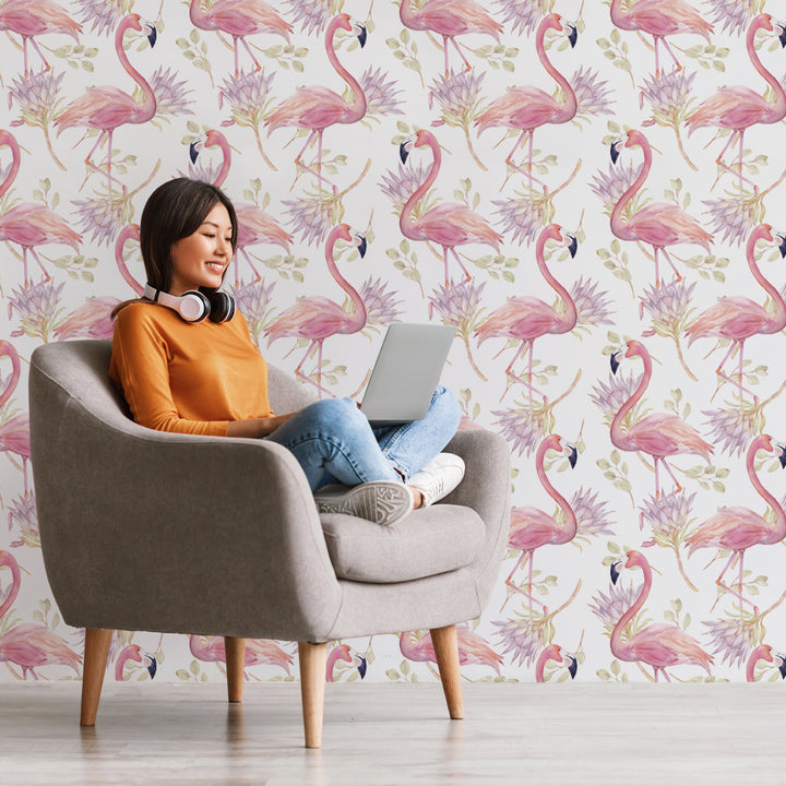 Watercolor flamingo wallpaper featuring pink tropical birds surrounded by flowers and greenery, ideal for nursery or bedroom décor, removable and damage-free.