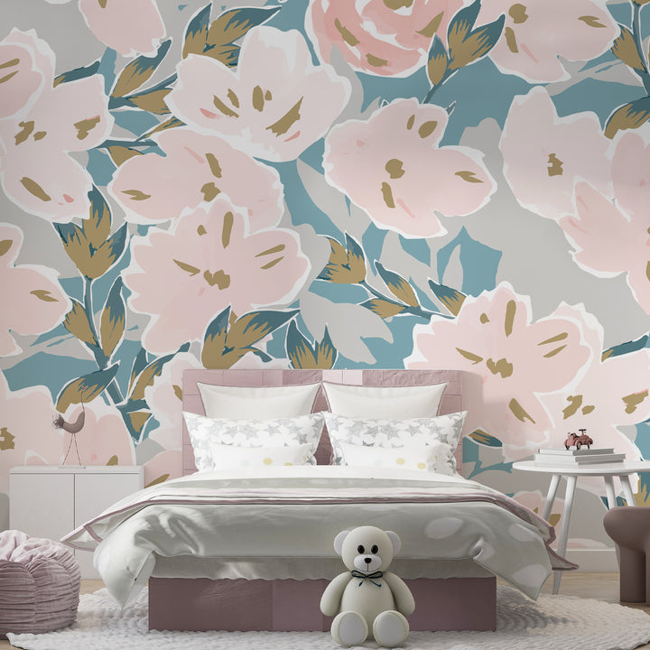 Oversized blush pink floral wallpaper with teal and sage green leaves on a neutral background