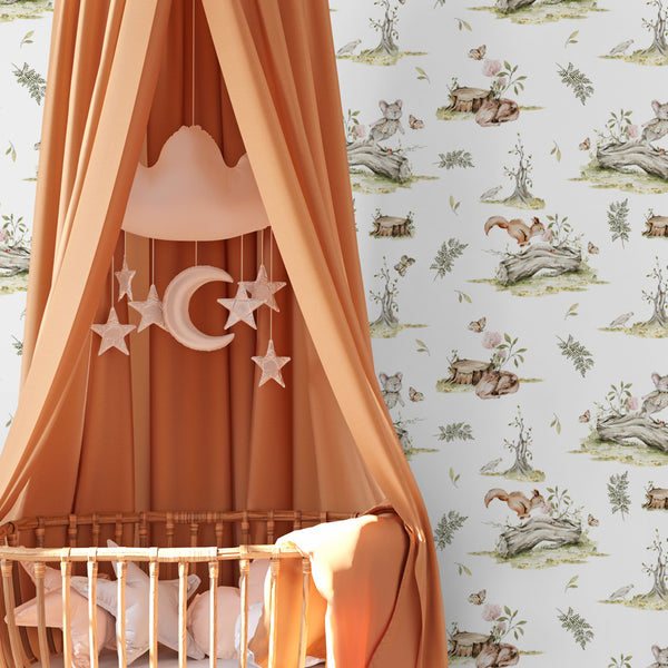 Vintage woodland toile wallpaper featuring hand-drawn forest animals, logs, butterflies, and botanicals on a soft light background, available in removable peel and stick or pre-pasted.
