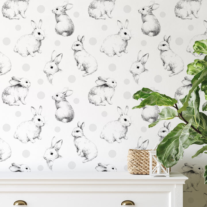 Whimsical rabbit wallpaper for baby room featuring hand-sketched bunnies in black and white, perfect for neutral nursery décor and easy DIY installation.