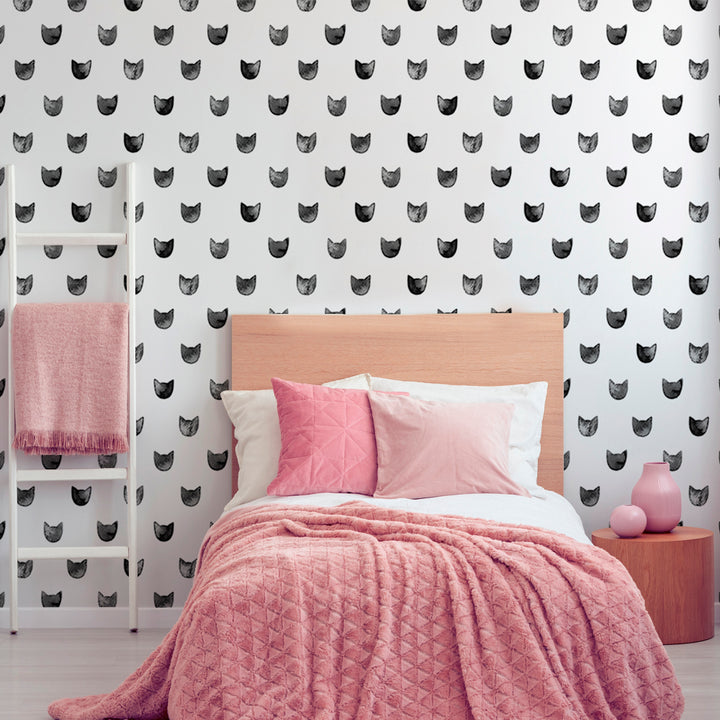 Modern monochrome cat print wallpaper with watercolor kitten heads in a simple repeating pattern for stylish nursery, kids room, or playful interior design.