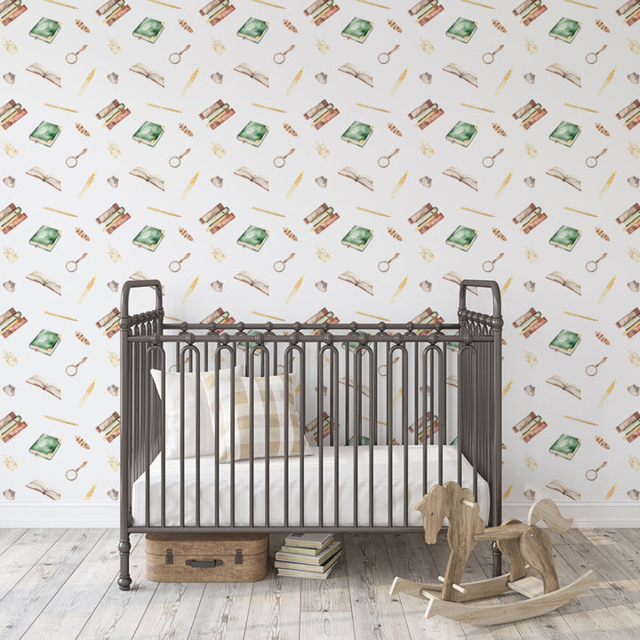 Watercolor wallpaper pattern with books, quills, candles, and magnifying glasses on a white background. harry potter peel and stick removable wallpaper