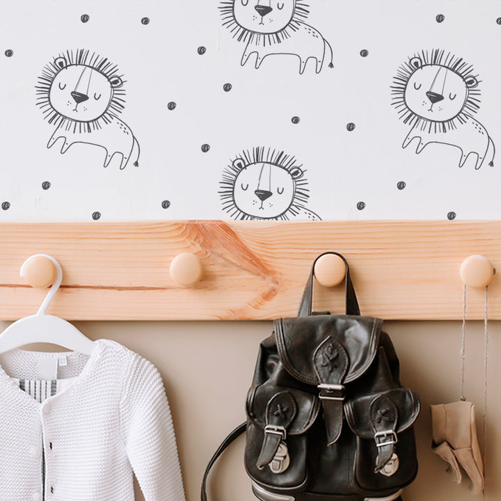 Hand-drawn lion print wallpaper in soft monochrome tones with a repeating pattern of cartoon lions and dots, removable and renter-friendly.