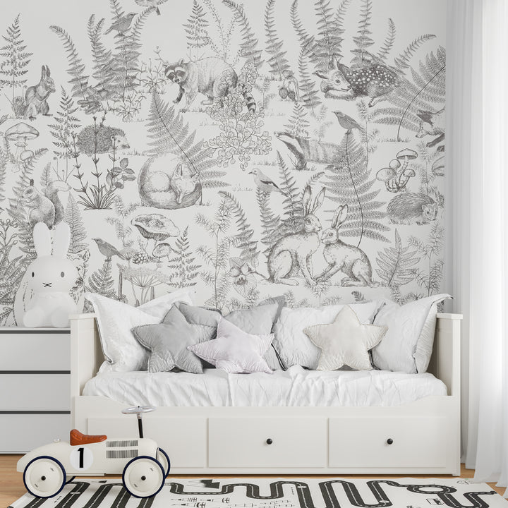Whimsical animal forest wall mural in soft monochrome botanical theme.