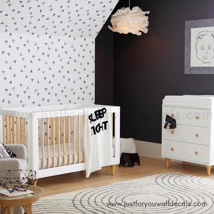 Contemporary geometric wallpaper design with small, modern black triangles in a random pattern., black and white wallpaper