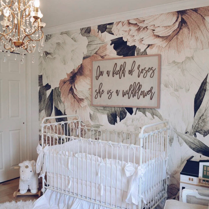 Large floral nursery wallpaper featuring blush peonies and soft foliage, printed on peel and stick removable wallpaper, perfect for accent walls in modern feminine bedrooms or playrooms.