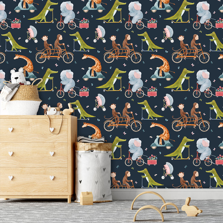 Whimsical navy wallpaper with watercolor animals riding bicycles and scooters, perfect for nurseries or playrooms, removable and wall-safe.
