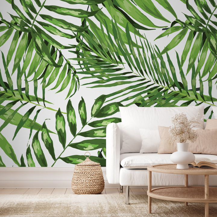 Oversized palm leaf pattern wallpaper in natural greens on white background, tropical and modern, available in peel and stick or pre-pasted options.