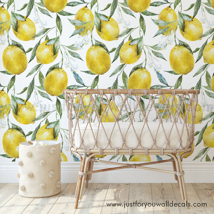 Elegant lemon-themed wallpaper with lush green foliage and ripe yellow lemons painted in soft watercolor strokes.