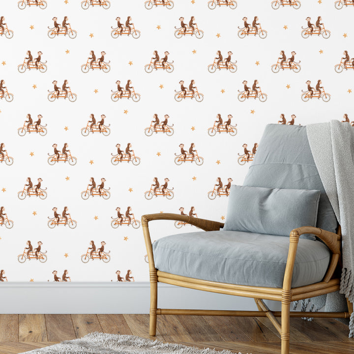 Nursery wallpaper featuring adorable monkeys on bicycles with stars, available in Peel & Stick or Pre-Pasted, removable without wall damage and easy to clean.