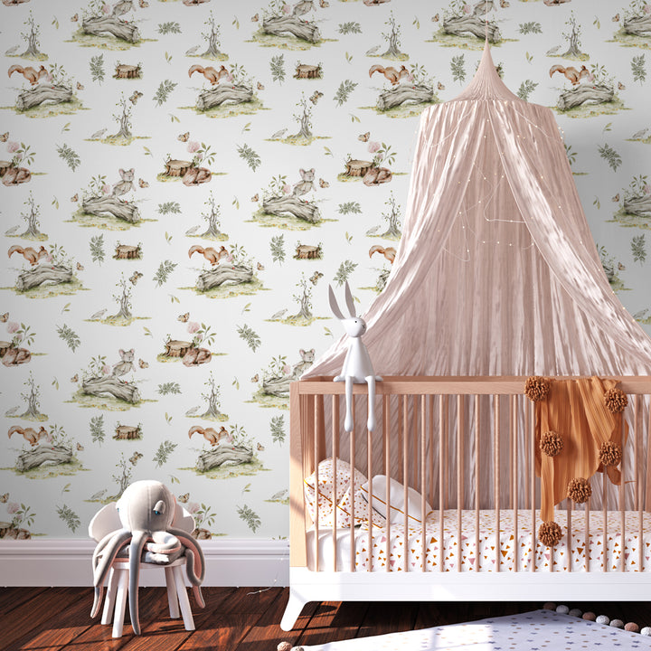Woodland nursery wallpaper featuring classic toile-style illustrations of small animals and nature scenes, designed in soft earthy colors for calm gender-neutral spaces.