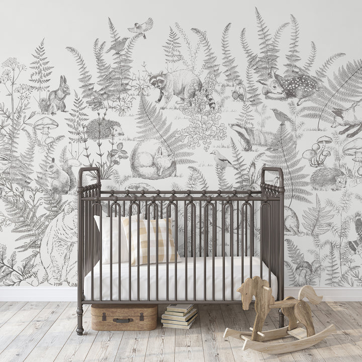 Forest animal wallpaper mural featuring raccoon, deer, and birds among ferns and mushrooms.