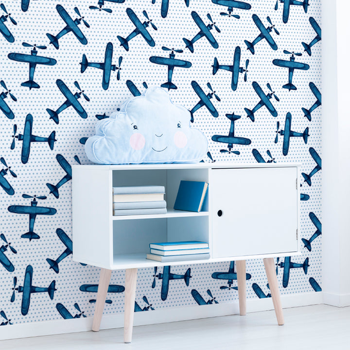 Vintage airplane wallpaper for boys room featuring blue watercolor planes and light dot pattern, printed on premium removable wallpaper for easy installation.