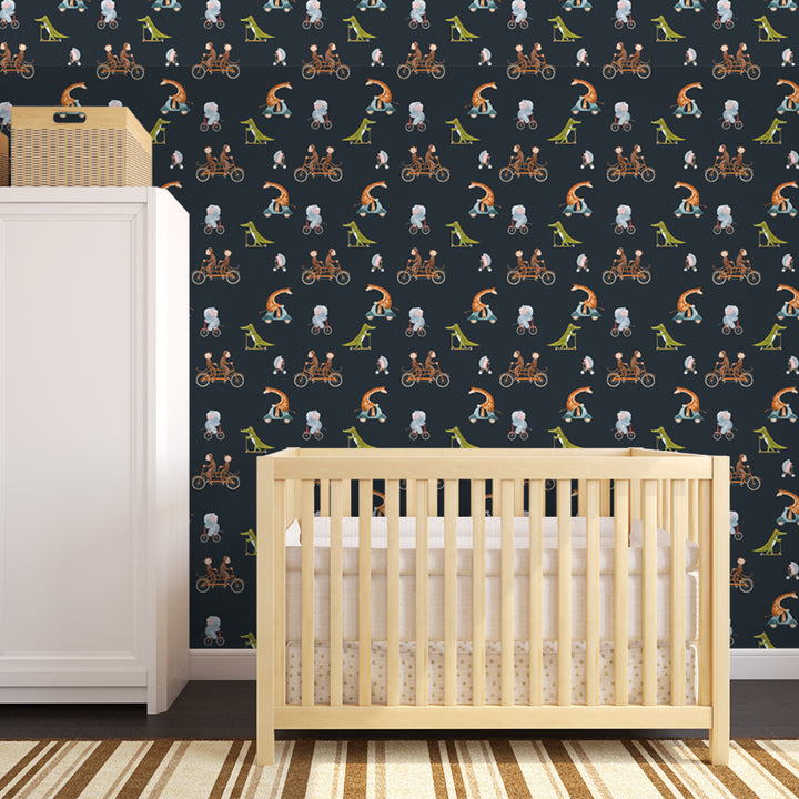 Watercolor nursery wallpaper showing elephants, giraffes, monkeys, and crocodiles cycling together on a dark background, removable and wall-safe design