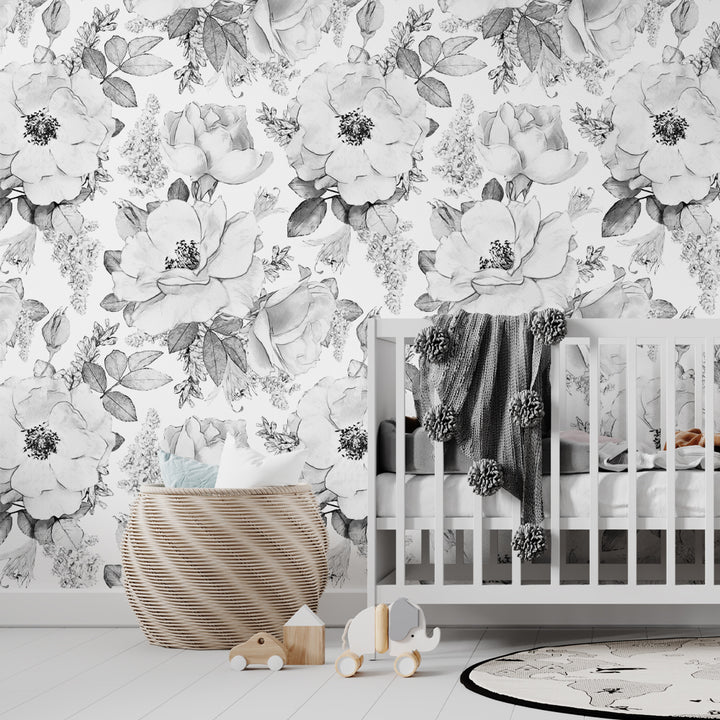 Black and white oversized floral wallpaper with hand-drawn peony-style blooms and leaves, available in peel and stick or pre-pasted removable material for bedrooms, nurseries, and accent walls.