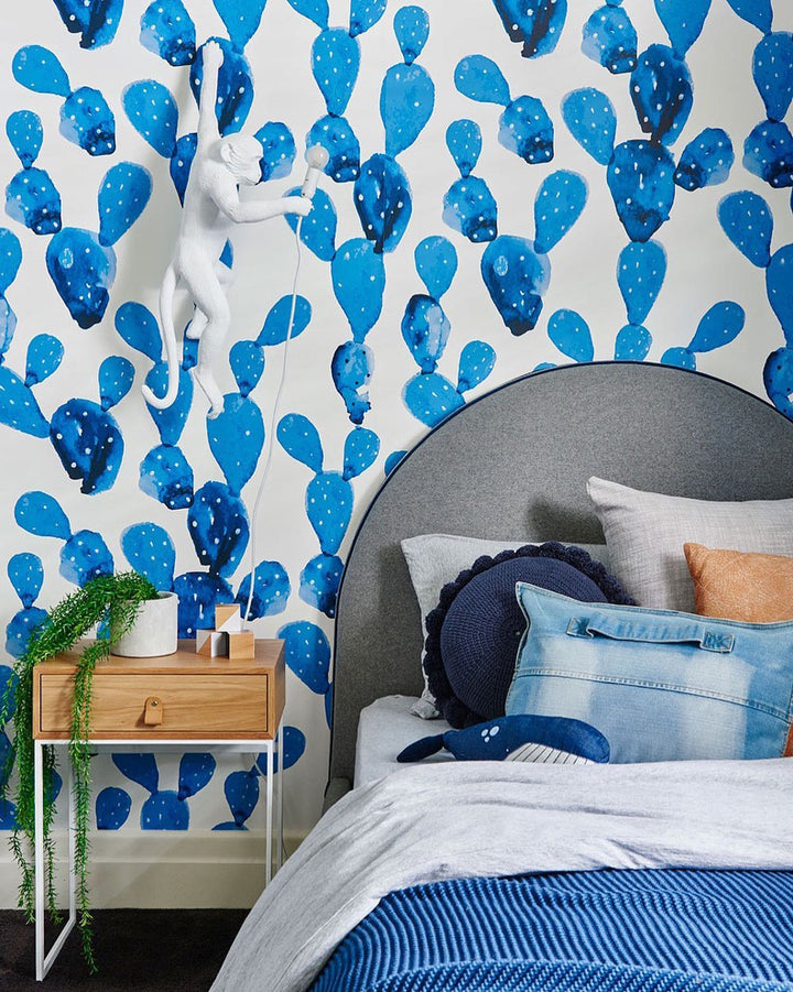 Hand-painted watercolor cactus wallpaper in calming blue tones creates a playful and soothing atmosphere for kids’ rooms. Available as peel and stick or pre-pasted removable wallpaper, both options safe, eco-friendly, and easy to install.