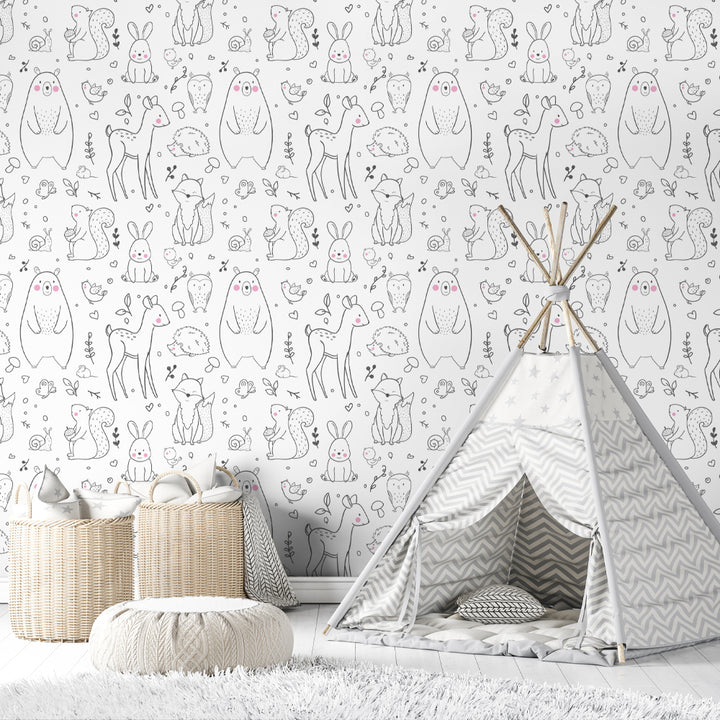 Scandinavian style woodland wallpaper featuring adorable deer, hedgehogs, and foxes outlined in black with subtle pastel details, removable and easy to apply peel-and-stick or pre-pasted wallpaper.