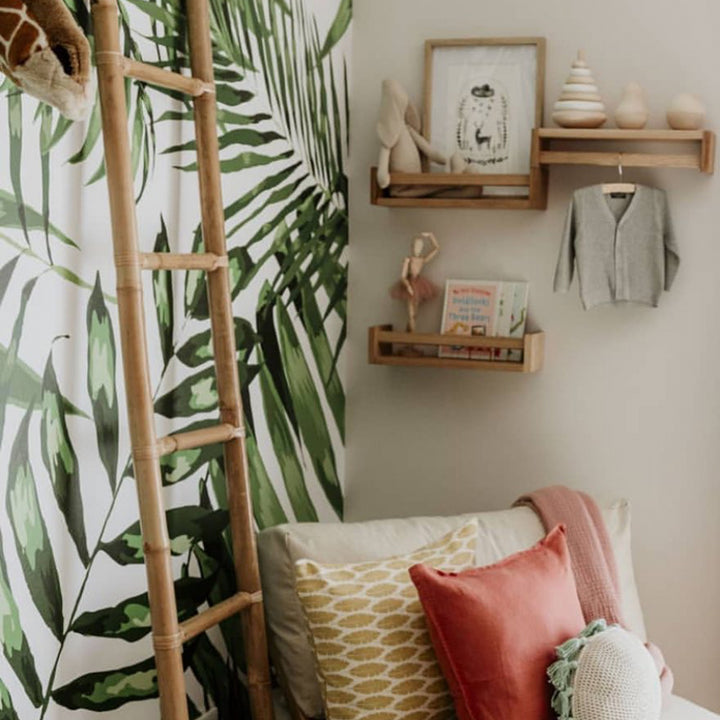 Safari-inspired palm leaf wallpaper for nurseries or kids’ rooms, creating a calming jungle feel with vibrant greenery, removable and DIY-friendly.