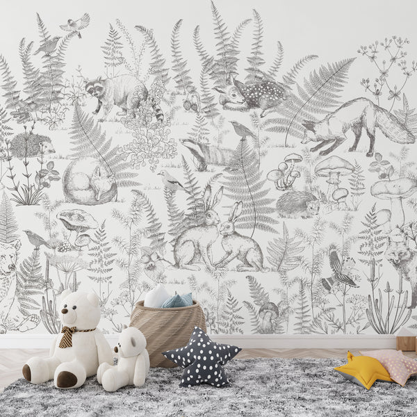 Hand-drawn woodland animal wallpaper mural with fox, rabbits, deer, and ferns in neutral black and white design.