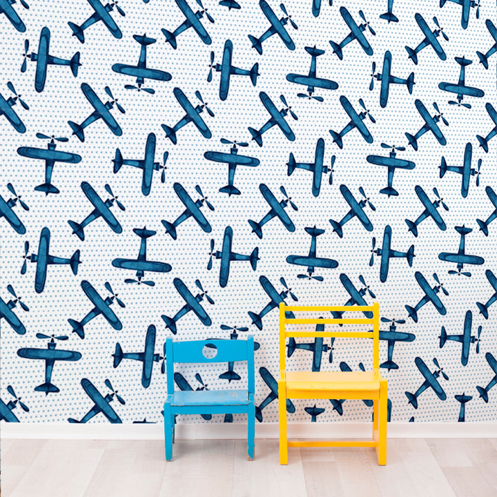 Kids airplane wallpaper design in calming blue tones with repeating watercolor aircraft, peel and stick or pre-pasted options available for easy DIY installation.