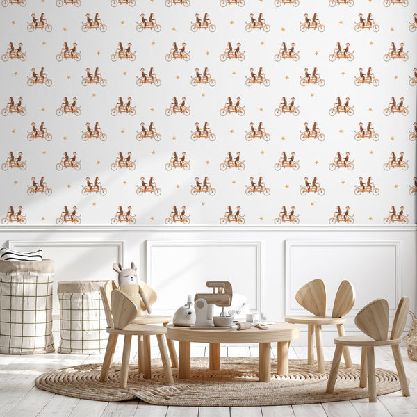 Whimsical monkey tandem bicycle wallpaper pattern featuring playful brown monkeys riding bikes with orange stars on a white background, perfect for kids’ rooms and nurseries.