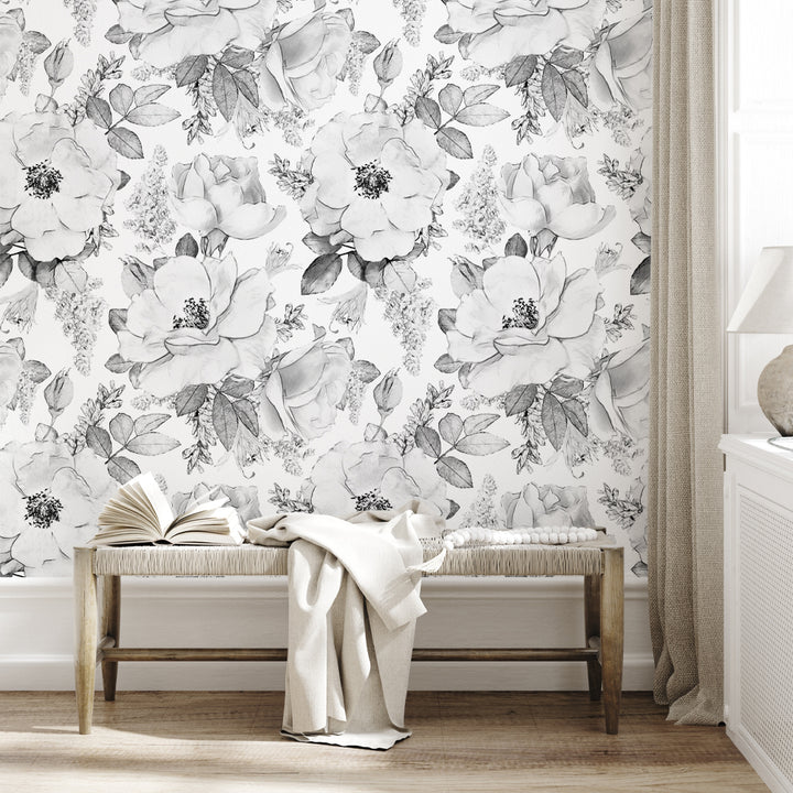 Black and white oversized floral wallpaper with hand-drawn peony-style blooms and leaves, available in peel and stick or pre-pasted removable material for bedrooms, nurseries, and accent walls.