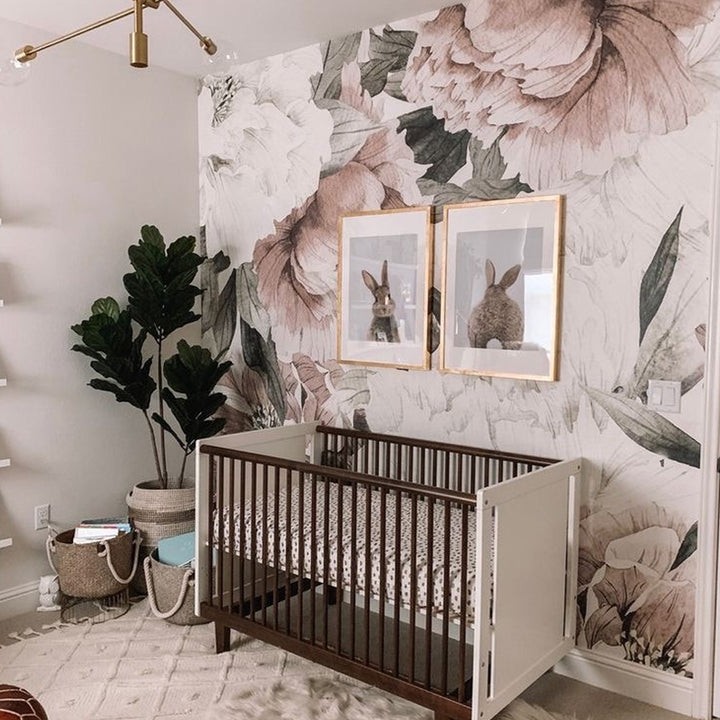 Large-scale watercolor peony wallpaper in soft blush, cream and green tones, designed for nursery accent walls, bedrooms, or living spaces, removable and available in peel and stick or pre-pasted.