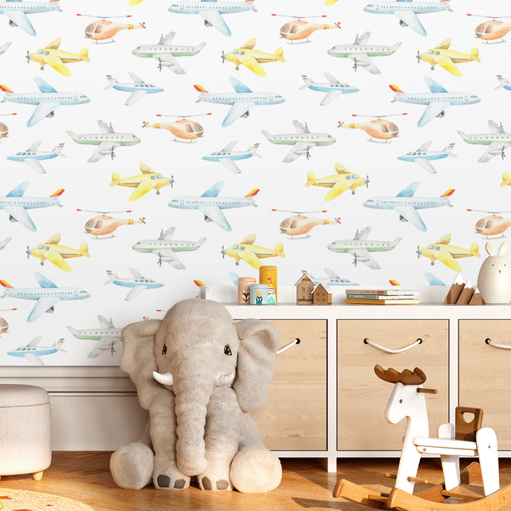Blue and yellow airplane wallpaper for boys rooms with hand-painted airplanes and helicopters on a bright white background, peel and stick or traditional wallpaper.