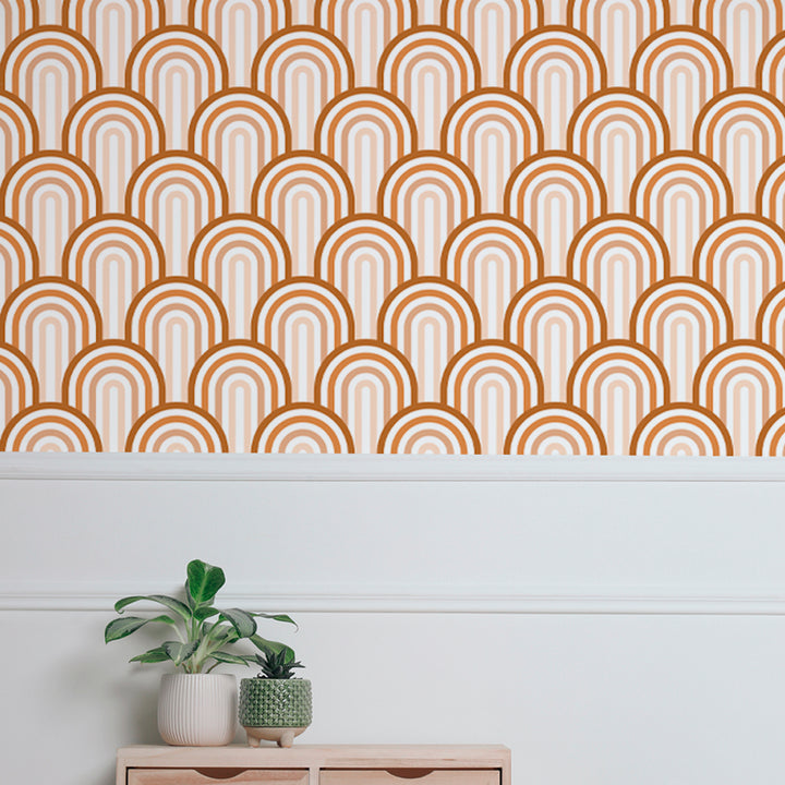 Warm retro rainbow arch wallpaper with repeating curved shapes in terracotta tones, printed on removable peel and stick or water-activated pre-pasted material.