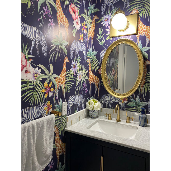 Playful jungle wallpaper with detailed animal illustrations of giraffes and zebras, accented by exotic leaves and flowers, eco-friendly, removable, and easy to apply.
