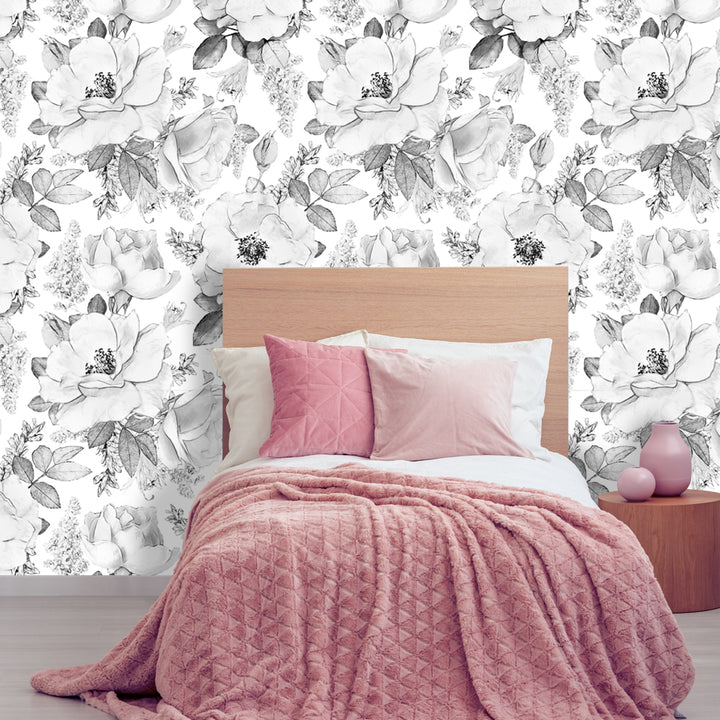 Removable floral wallpaper with charcoal black petals and white background, oversized modern flower design available in peel and stick or pre-pasted panels for contemporary home decor.