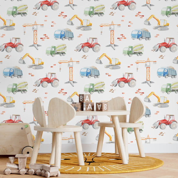 Kids construction wallpaper with watercolor dump trucks, cranes, tractors and excavators in a repeating pattern on a white background, available in removable peel and stick or pre-pasted wallpaper.