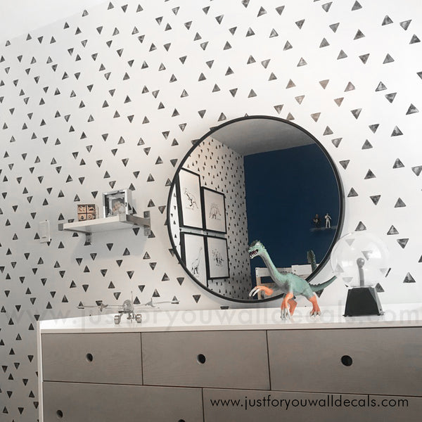 Minimalist wallpaper featuring scattered black triangles on a clean white background. black and white boys room wallpaper