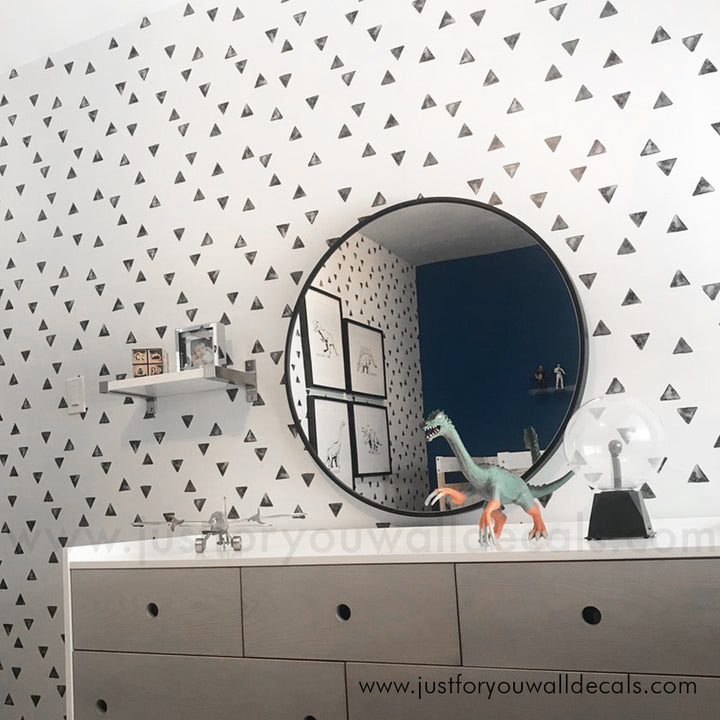 Minimalist wallpaper featuring scattered black triangles on a clean white background. black and white boys room wallpaper