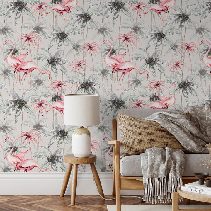 Pink flamingo wallpaper on grey background with green palm trees, tropical modern design, available as removable peel and stick or pre-pasted material.