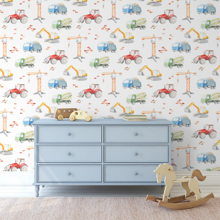 Watercolor construction vehicle wallpaper featuring playful trucks, cranes and diggers in bright colors on white, designed for boys rooms, nurseries or playrooms, printed as removable wallpaper.